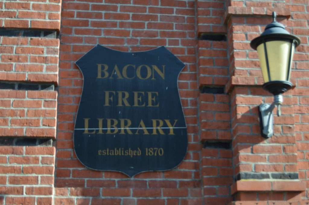 bacon free library south natick sign