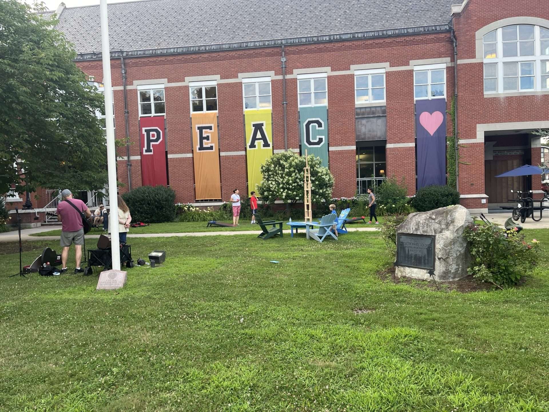 Music in front of Morse Institute Library Peace flags Music in front of Morse Institute Library Peace flags