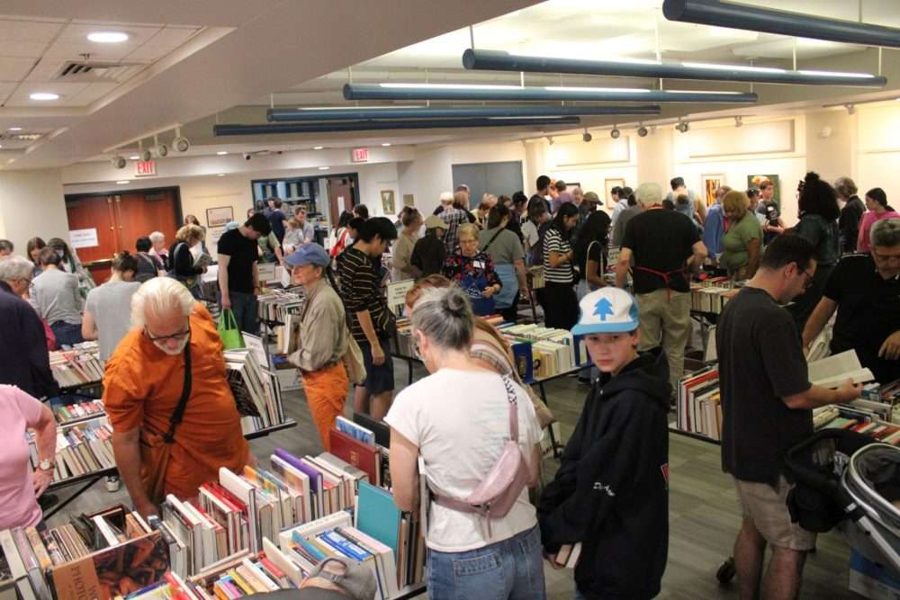 Bargain-hunters peruse the offerings at the Friends of the Morse Institute Library’s Book andBake Sale on Sept. 27.