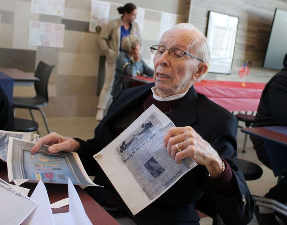 Billy Thomas, who served in the Air Force during the Korean War, shows newspaper clippings of hisexperience to Kennedy Middle School during the annual Veterans Breakfast on Nov. 7.
