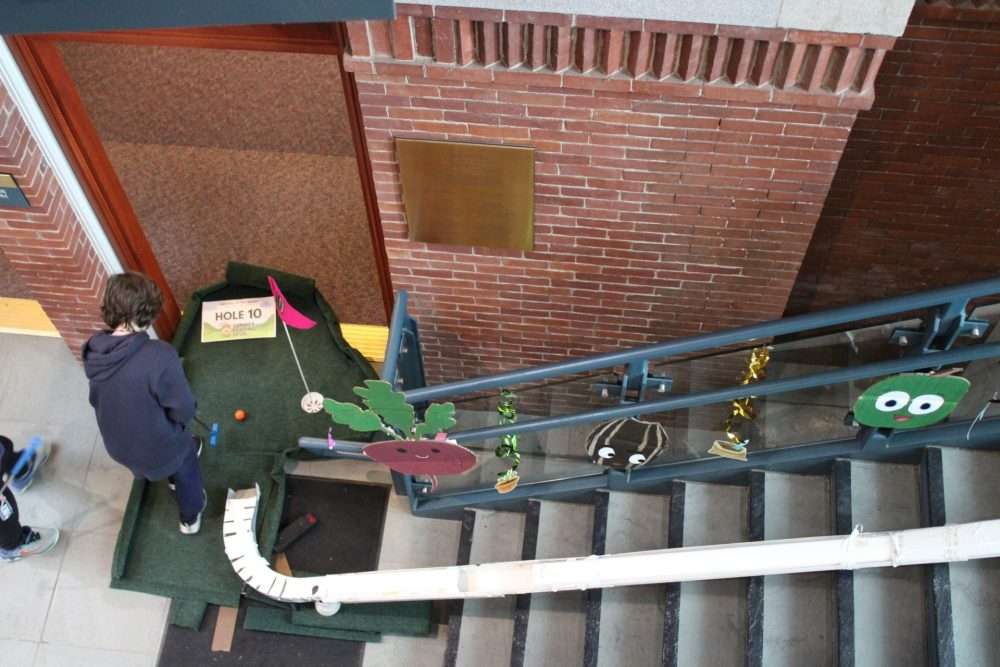 The 10 th hole stretched down the main staircase of the Morse Institute Library.