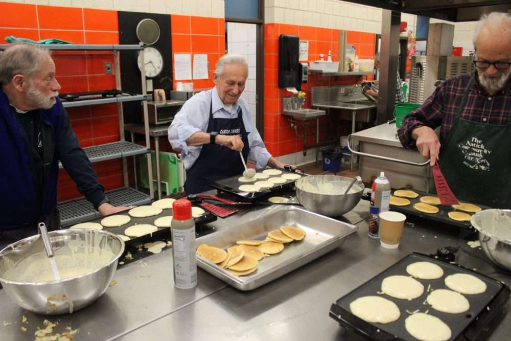 Part of the volunteer breakfast crew at the annual Maple Magic, sponsored by the NatickCommunity Organic Farm, at the nearby Memorial School on March 14.