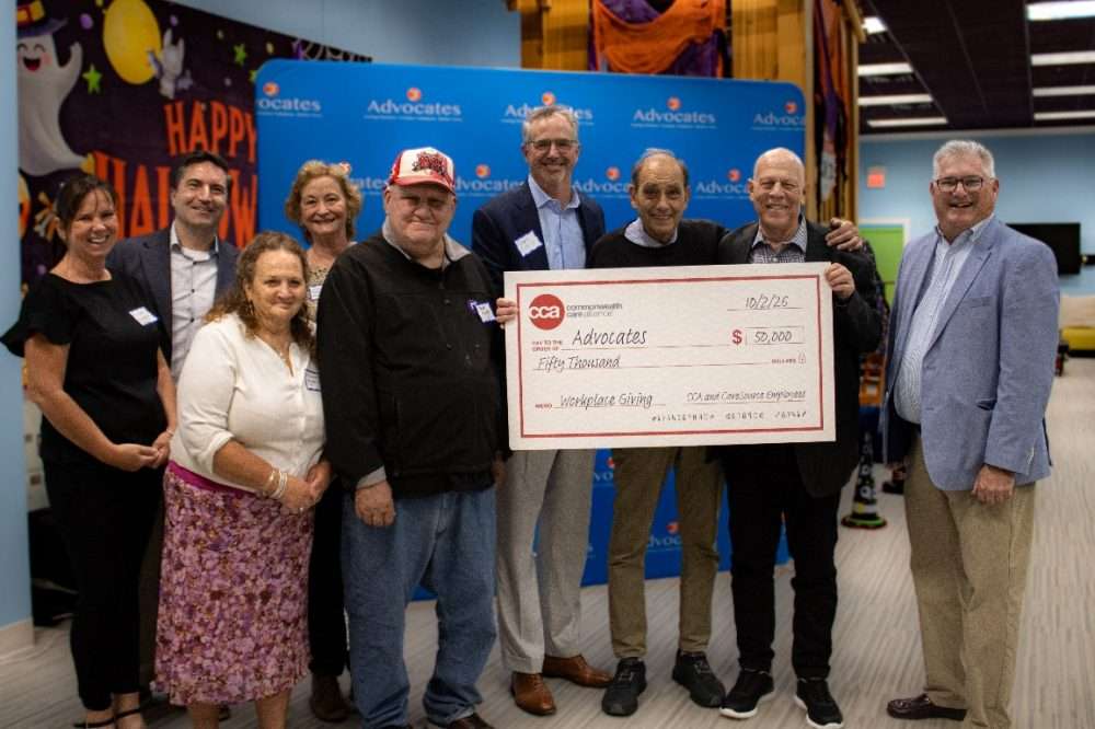 Commonwealth Care Alliance and CareSource employees present $50,000 donation to the Massachusetts-based nonprofit organization Advocates at the Autism Welcoming Center at the Natick Mall.